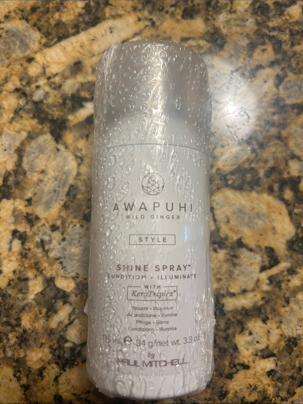 Paul Mitchell Awapuhi Wild Ginger Shine Spray in White Bottle
